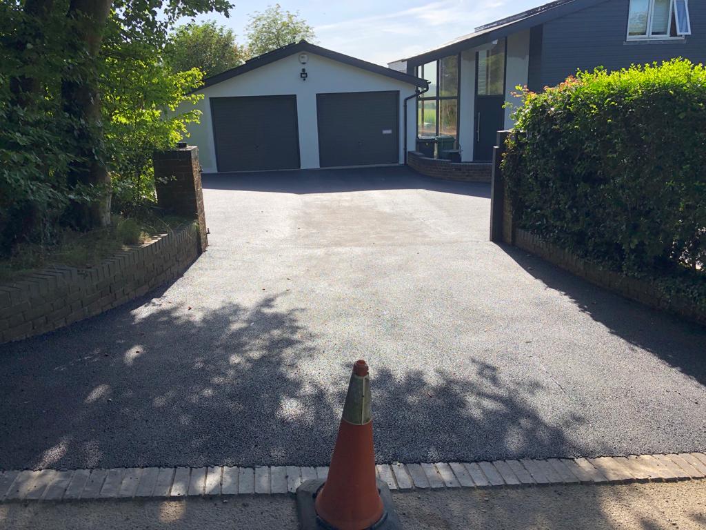 This is a photo of a bitumen driveway which is in the process of being installed by Yarrambat Road Tech